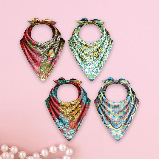 Four colorful bandanas with intricate patterns on a pink background