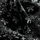 Black fabric with white paisley patterns