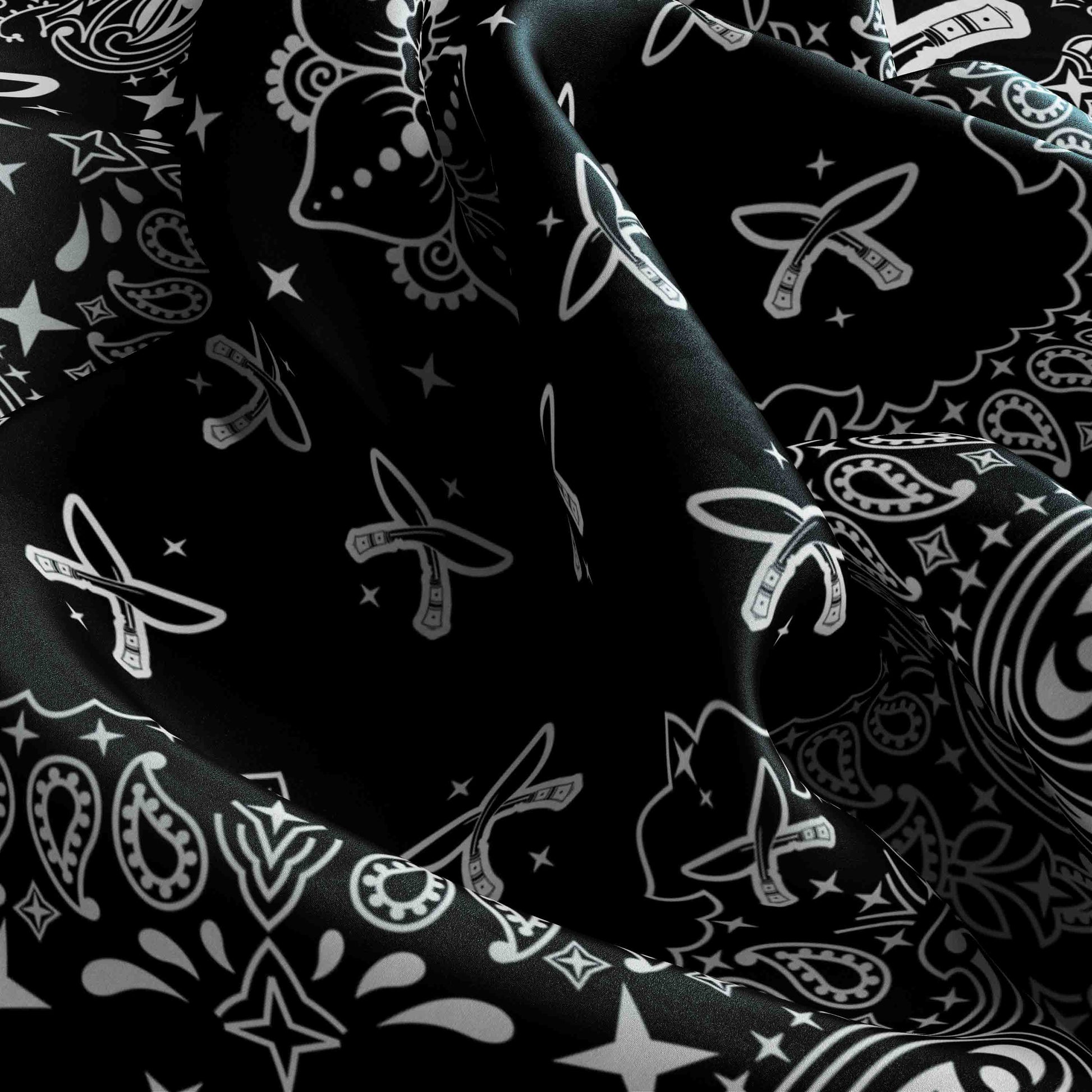 Black fabric with white paisley patterns