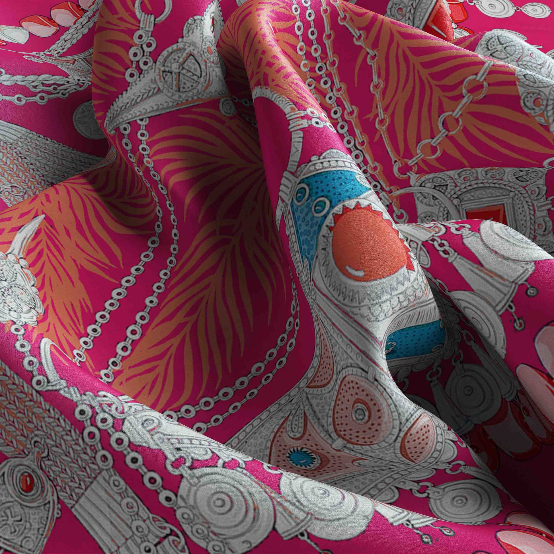 Close-up of a vibrant pink fabric with intricate patterns and designs.