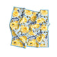 Floral patterned fabric with yellow roses and blue flowers on a light blue background