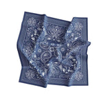 Blue bandana with white paisley pattern on a white background