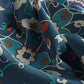 Close-up of fabric with a blue and white floral pattern