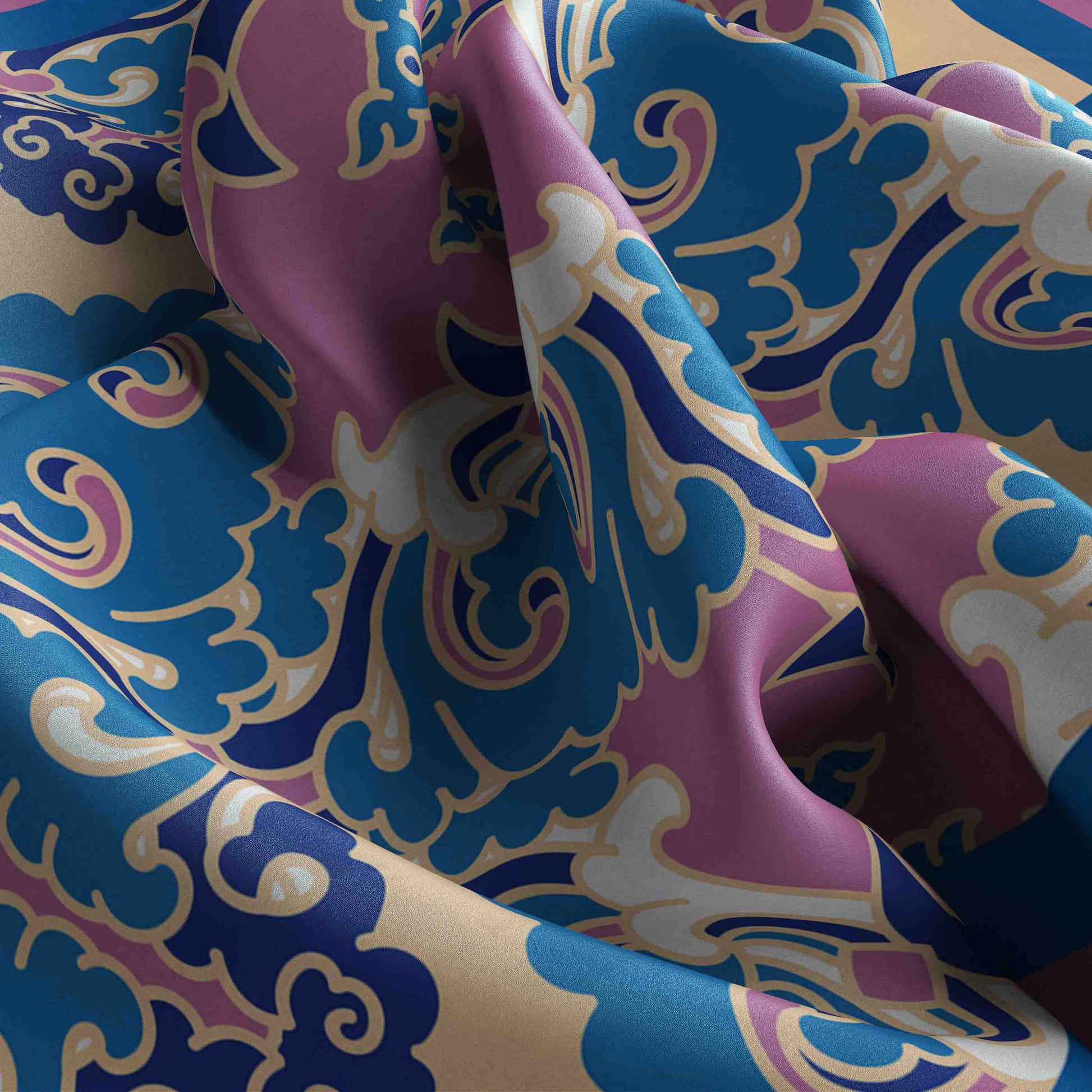 Close-up of colorful fabric with intricate patterns in blue, pink, and white.
