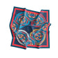 Colorful patterned scarf with blue, red, and yellow design on a white background