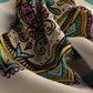 Colorful patterned fabric with intricate designs on a neutral background