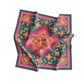 Colorful floral patterned scarf on a white background