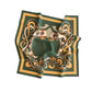 Decorative green scarf with gold and white patterns on a white background