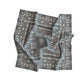 Folded bandana with intricate pattern on a white background
