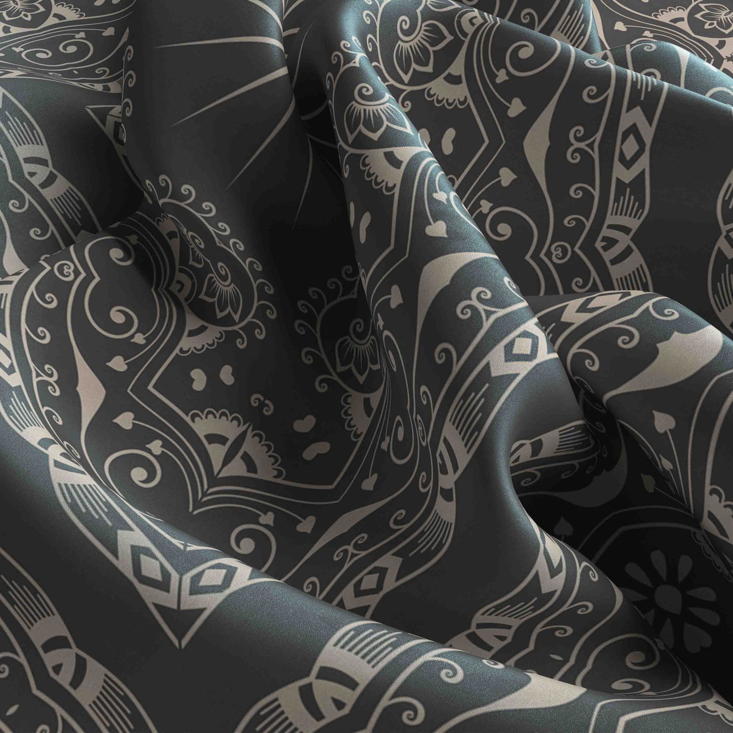 Close-up of dark fabric with intricate white patterns