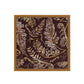 Fern patterned fabric with a wooden frame on a white background