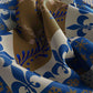 Close-up of fabric with blue, brown, and white pattern