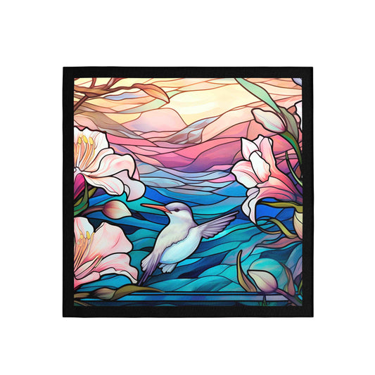 Framed artwork of a colorful stained glass-style design with flowers and a bird.