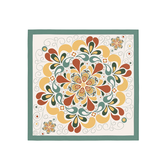 Decorative quilt with a colorful floral pattern on a white background
