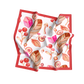 Folded fabric with a colorful pattern on a white background