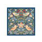 Decorative fabric square with floral and bird pattern on a blue background
