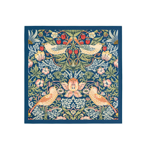 Decorative fabric square with floral and bird pattern on a blue background
