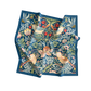 Decorative blanket with floral and bird pattern on a white background