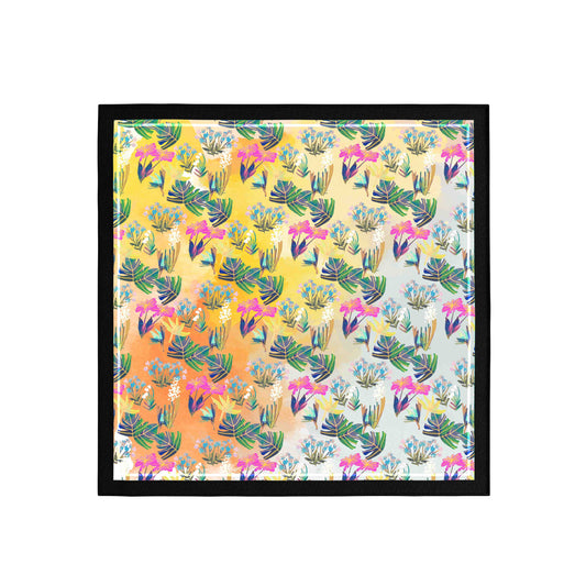 Framed artwork with a colorful pattern of cacti and flowers on a yellow background