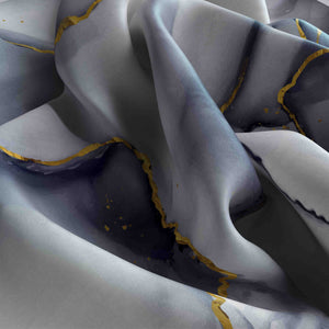 Close-up of gray fabric with yellow trim