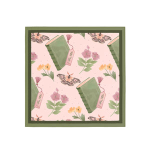 Framed artwork with books and flowers on a pink background