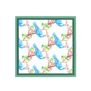 Pattern of blue birds on branches with green frame