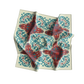 Decorative fabric with red and blue floral pattern on a white background