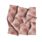 Red floral patterned fabric on a white background