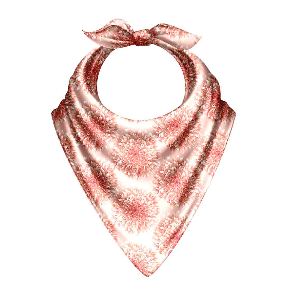 Pink and white patterned baby bib on a white background