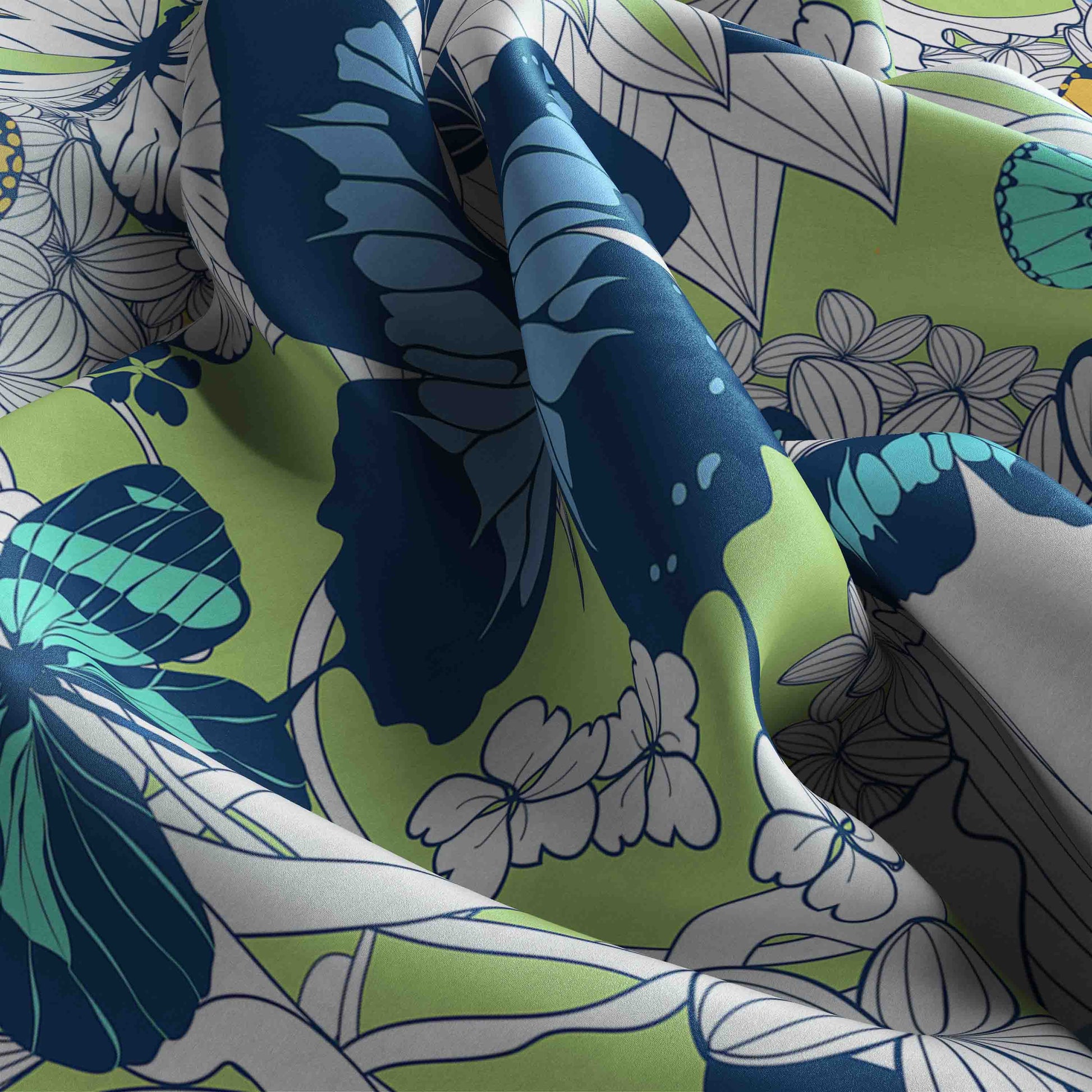 Close-up of fabric with blue, green, and white butterfly pattern