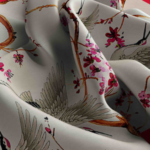 Close-up of fabric with floral and bird pattern