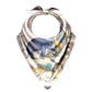 Bib with animal print featuring elephant, giraffe, lion, and tiger on a white background