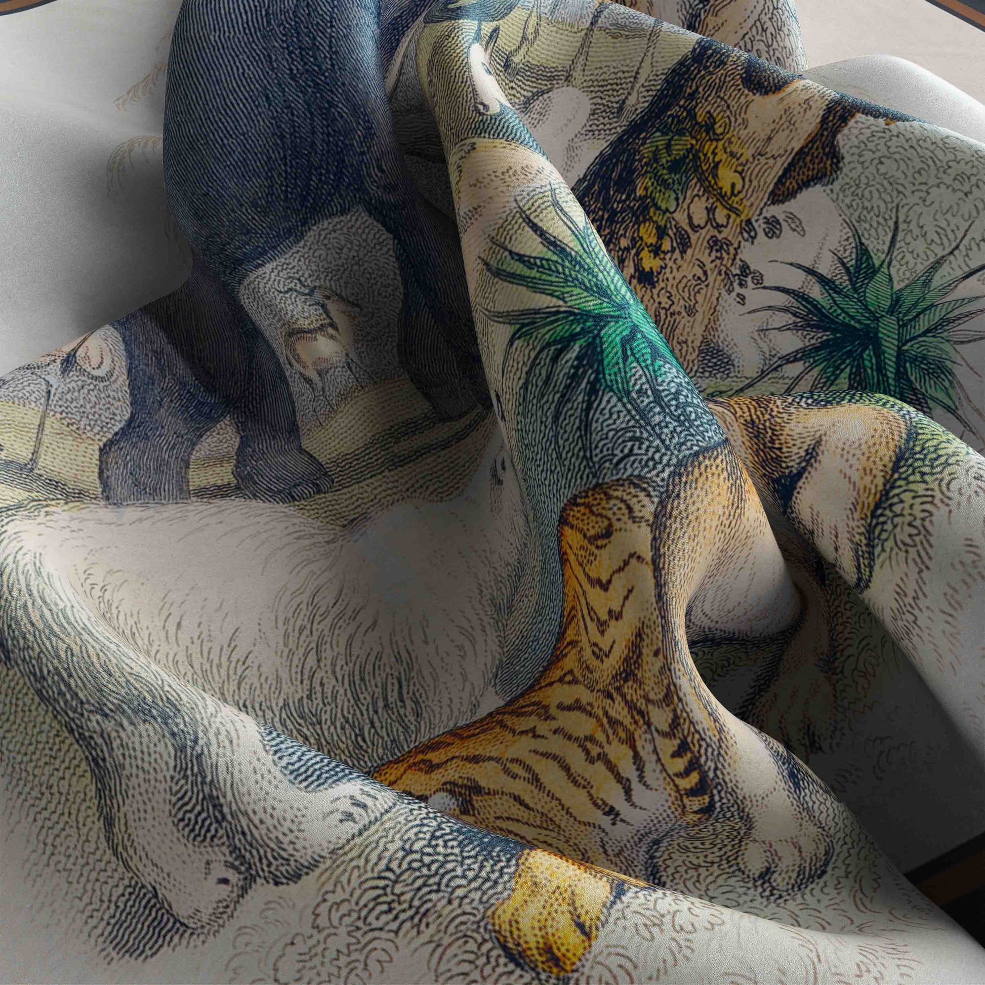 Close-up of a patterned fabric with animals and nature design.