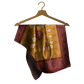 Patterned scarf on a wooden hanger against a white background