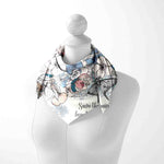 Mannequin wearing a floral scarf with text on a white background