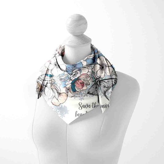Mannequin wearing a floral scarf with text on a white background