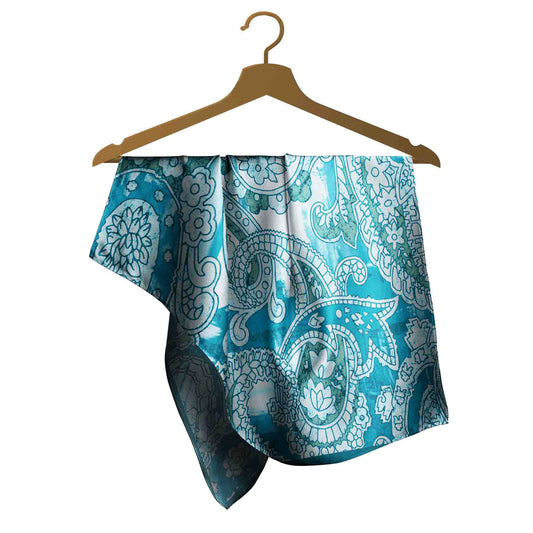 Blue and white patterned fabric draped over a wooden hanger on a white background