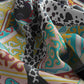 Colorful fabric with abstract patterns and black and white cow print
