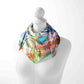 Colorful scarf with abstract designs on a mannequin against a white background