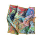 Colorful scarf with sea-themed design featuring sharks, fish, and other marine life on a white background.