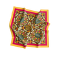 Colorful patterned scarf with pink border on a white background