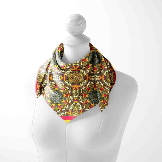 Colorful patterned scarf on a mannequin against a white background