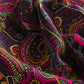 Close-up of a fabric with a vibrant, multicolored pattern.