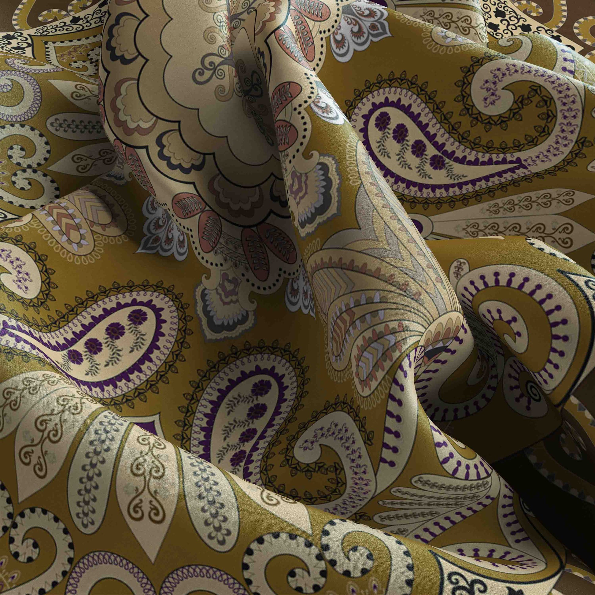Close-up of patterned fabric with paisley design in gold, purple, and beige.